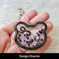 Resign Charms